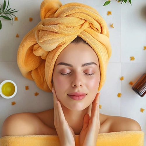 Women in orange bathrobe applying body scrub