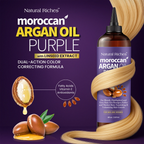 Bottle of Natural Riches Moroccan Argan Oil Purple hair product on a purple background with argan oil and hair strands.