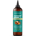 Bottle of Natural Riches Moroccan Argan Oil Hair Treatment on a white background
